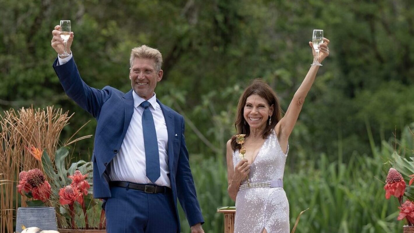 Gerry Turner and Theresa Nist raising champagne on The Golden Bachelor